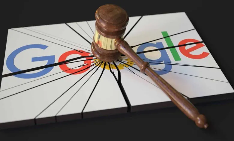Gavel striking Google logo, symbolizing legal action.