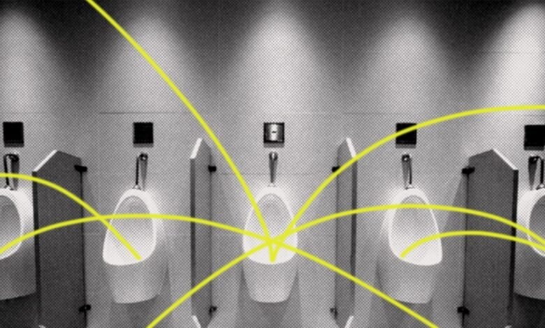 Row of urinals with yellow lines suggesting tracking technology.