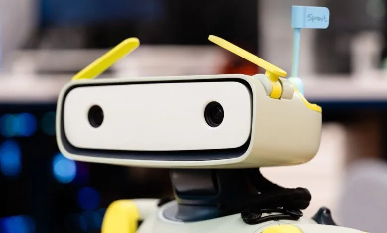 Close-up of a friendly-looking robot with a 'Sprout' name tag.