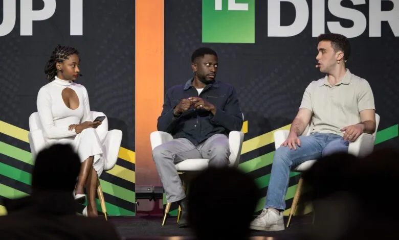 Panel discussion with three people on stage at TechCrunch Disrupt.