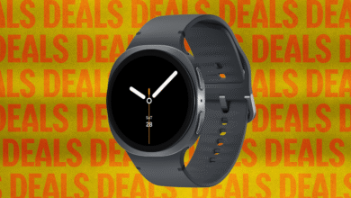 Gray smartwatch with a black screen showing the time and date.