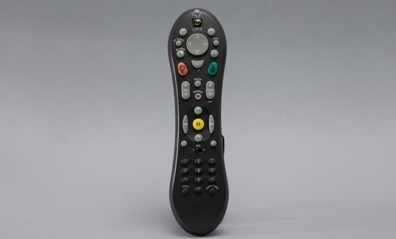 TiVo remote control with various buttons for TV functions.