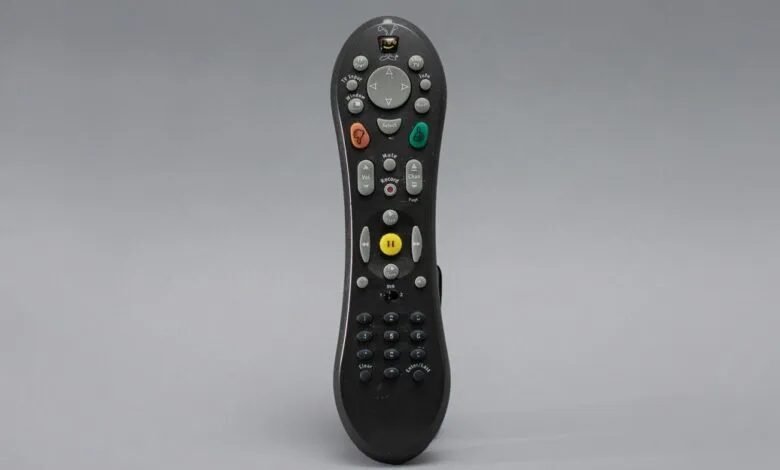TiVo remote control with various buttons for TV functions.