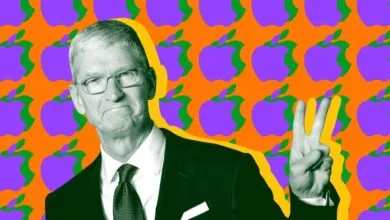 Tim Cook gives peace sign against Apple logo background.