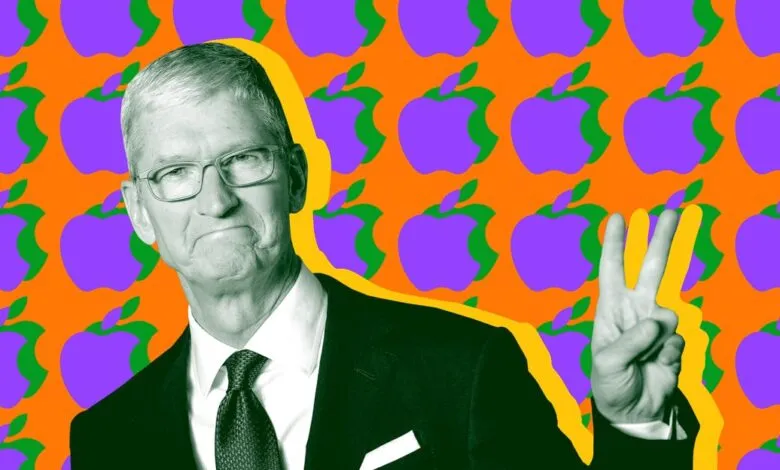 Tim Cook gives peace sign against Apple logo background.