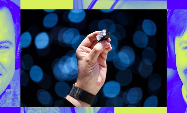 Hand holds small light against bokeh background, two faces on either side.