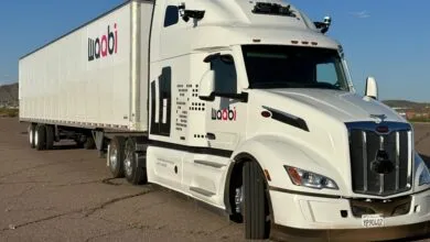 Waabi self-driving truck with sensors on a sunny day.