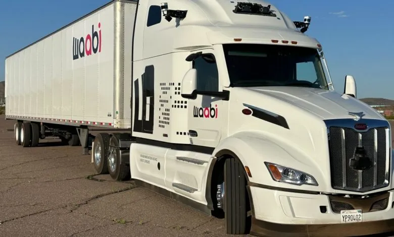 Waabi self-driving truck with sensors on a sunny day.