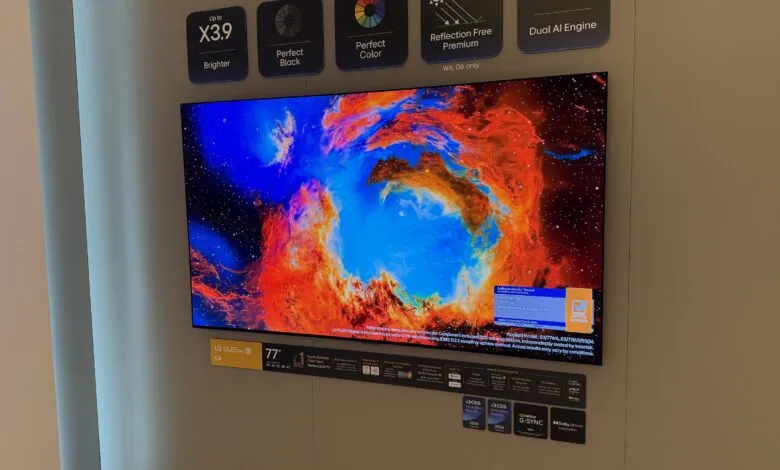 LG OLED evo C6 77-inch TV displaying a vibrant nebula image.