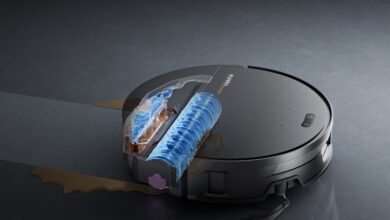 Eureka Z50 robot vacuum cleaner cleaning a dirty floor with fresh water.