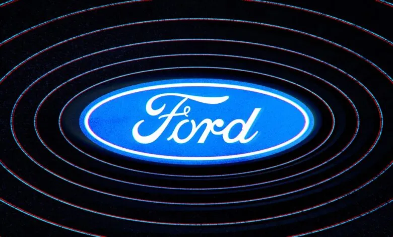 Ford logo, blue oval with white script, surrounded by concentric circles.