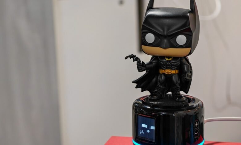 Batman Funko Pop figure on a speaker, dark and detailed.