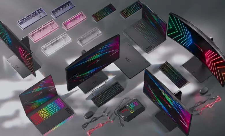 HyperX gaming setup with monitors, laptops, keyboards, and accessories.