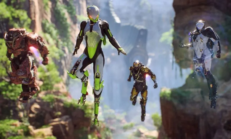 Four armored figures hover in a lush, mountainous landscape.