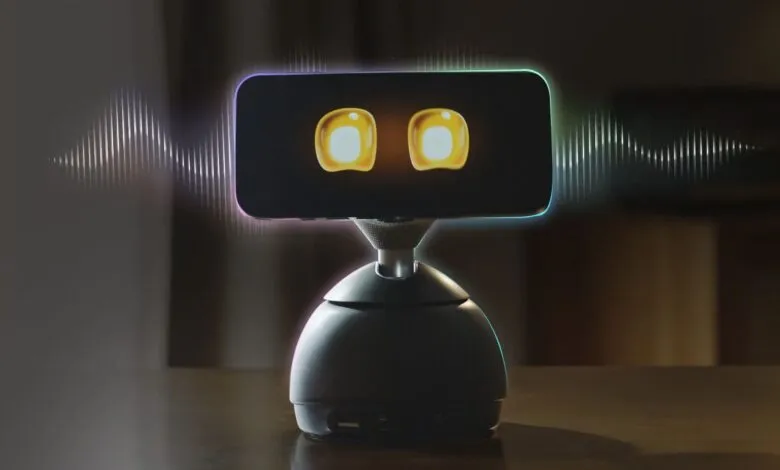 Interactive robot with screen eyes and colorful edge lighting.