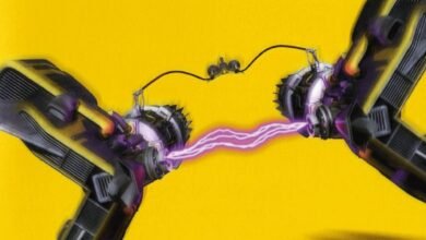 Two futuristic engines connected by a purple energy beam.