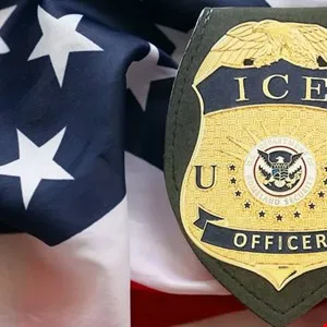Close-up of an ICE badge resting on a folded American flag.