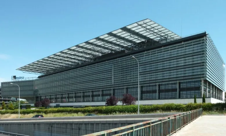 Endesa headquarters building with glass facade and large canopy roof.