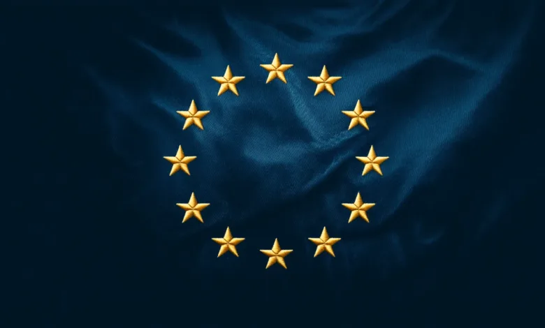 European Union flag with twelve golden stars on a blue background.