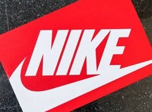 Close-up of a red Nike shoebox with a white swoosh logo.
