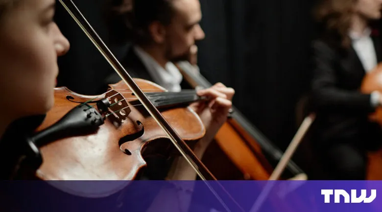 String quartet performing with violins and cello in concert setting.