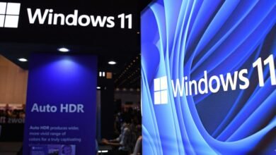 Windows 11 logo and Auto HDR display at a technology conference.