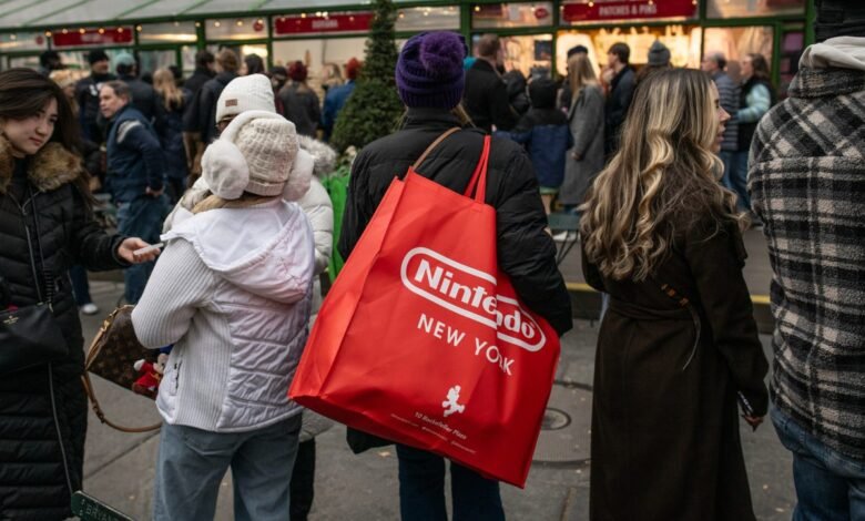 Crowd scene with a Nintendo New York shopping bag in focus.