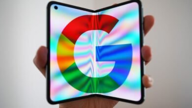 Foldable phone displaying the Google logo on a vibrant, colorful screen.