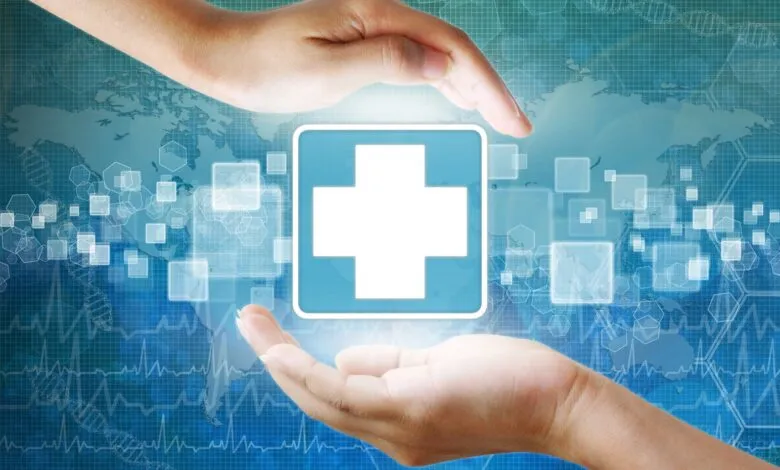 Hands protect a medical cross symbol on a digital background.