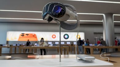 Apple Vision Pro headset on display in a store setting.