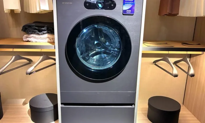 LG Signature washer in closet, sleek design, blue interior.