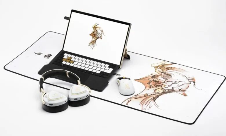 ROG Zephyrus laptop, headphones, and mouse on a themed desk mat.