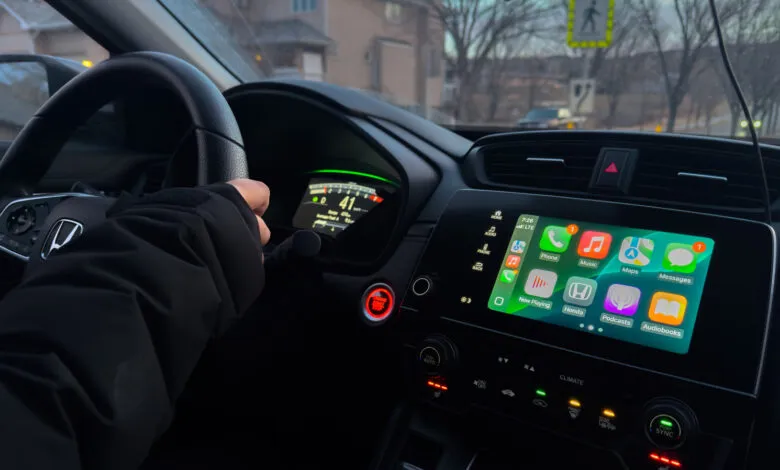 Interior view of Honda car with Apple CarPlay display showing navigation.