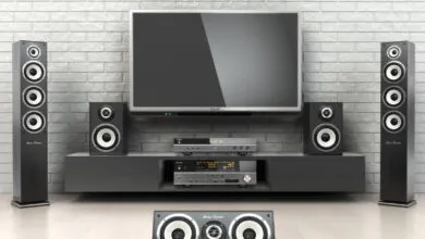 Home theater setup with TV, speakers, and audio equipment.