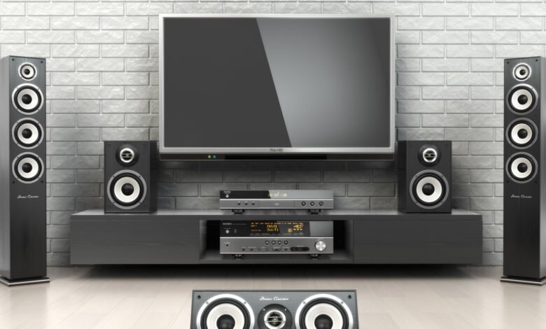 Home theater setup with TV, speakers, and audio equipment.