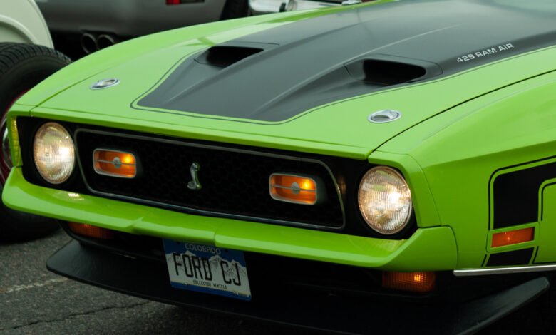 Lime green 1971 Ford Mustang Mach 1 with black accents.