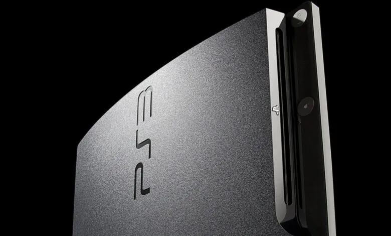 Close-up of a PlayStation 3 console against a black background.