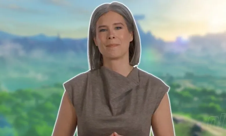 Woman with gray hair stands before a blurred landscape backdrop.