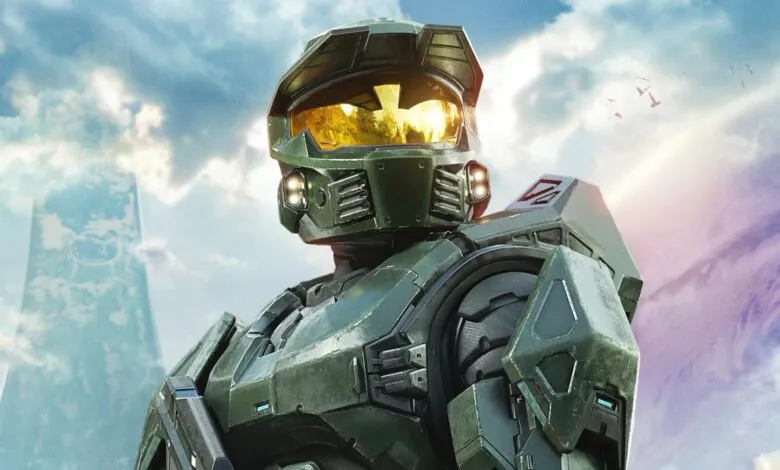 Close-up of Master Chief in green armor against a sky background.