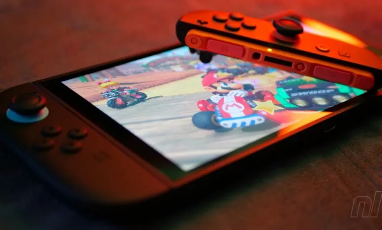Nintendo Switch console displaying Mario Kart game with Joy-Con controller.
