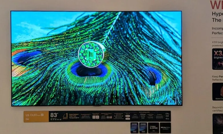 83-inch LG OLED evo AI G6 TV displaying vibrant peacock feather image.