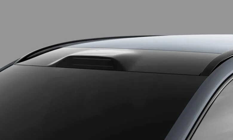 Close-up of a car roof with integrated sensor pod.