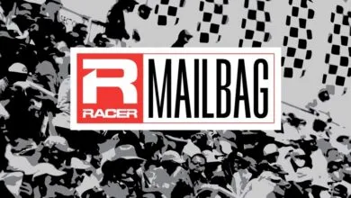Racer Mailbag logo with crowd and checkered flag background.