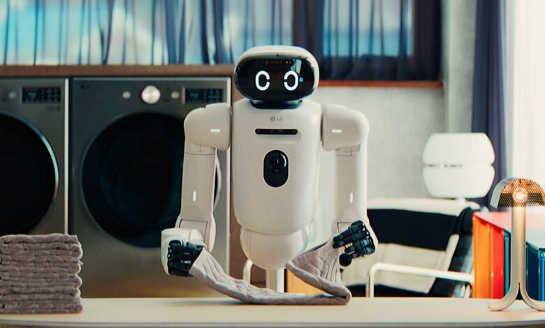 LG CLOi robot folding laundry in a modern laundry room setting.