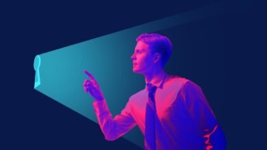 Man in shirt points to keyhole-shaped light, symbolizing opportunity.