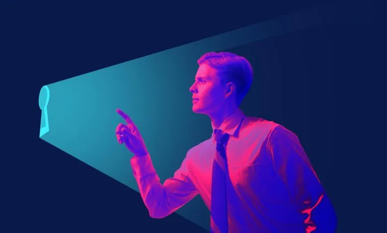 Man in shirt points to keyhole-shaped light, symbolizing opportunity.