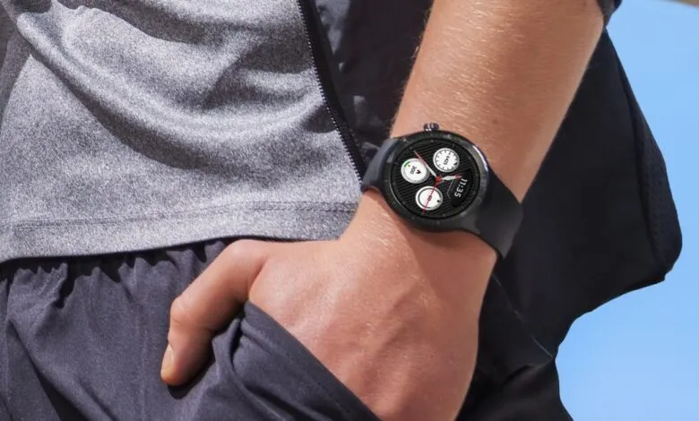 Close-up of a smartwatch on a person's wrist, showing fitness tracking data.