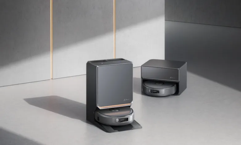 Modern robot vacuum and charging station in a minimalist setting.