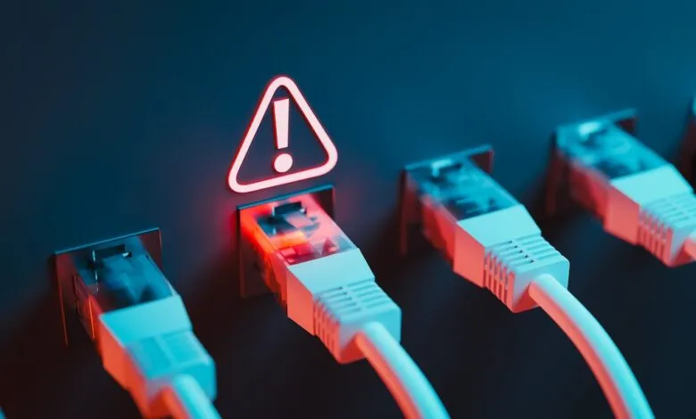 Network cables plugged in, one with a red warning sign indicating a security threat.