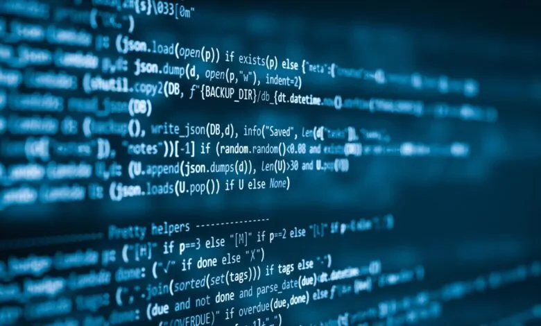 Lines of blue code displayed on a dark computer screen.